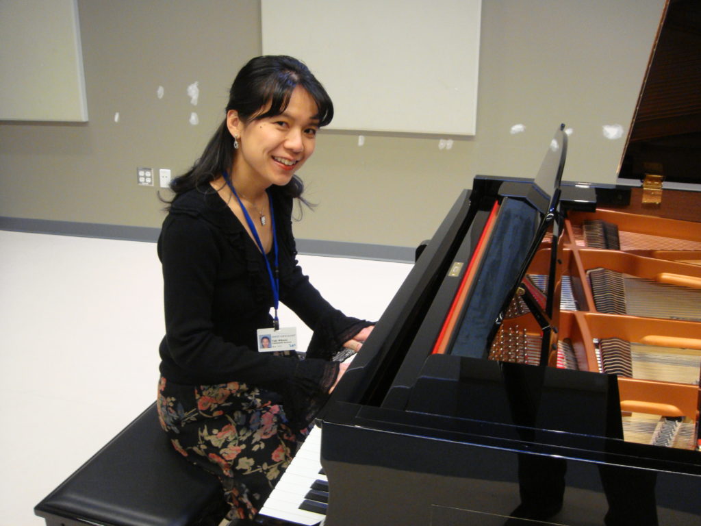 West Vancouver's piano teacher Yuki is performing at the grand piano of West Vancouver Community Centre and is getting ready to host a student piano recital.