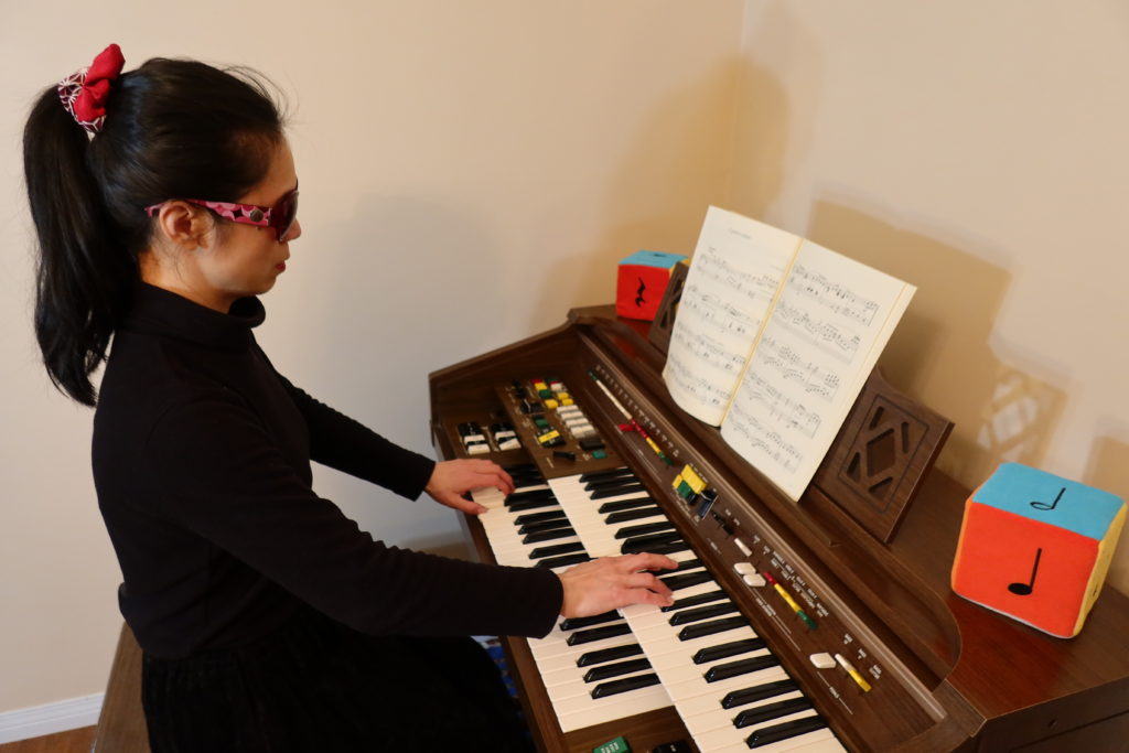 West Vancouver's piano teacher Yuki performs a piano piece at her Yamaha Electone, an electronic organ.